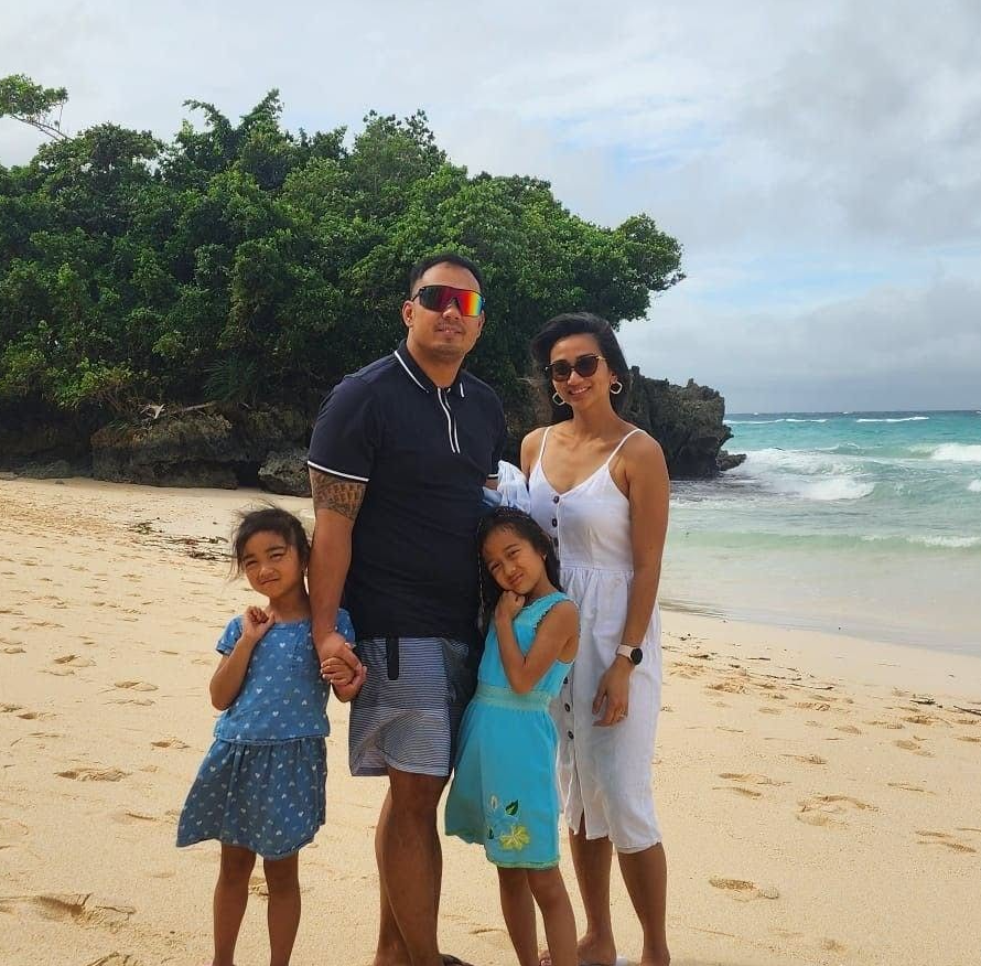 Chris and his family on a beach